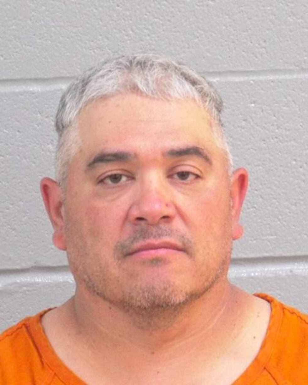 A man was arrested for cashing fraudulent checks at a bank in Midland County.