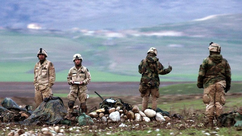 Paratroopers of the U.S. Army's 173rd Airborne prepare their equipment at the Harir airfield,...