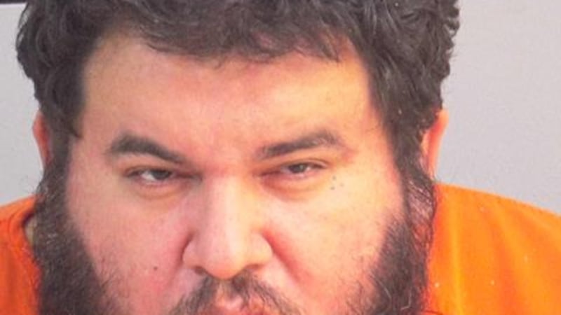 A man was arrested after threatening neighbors with a hatchet at the Santa Fe Apartments.